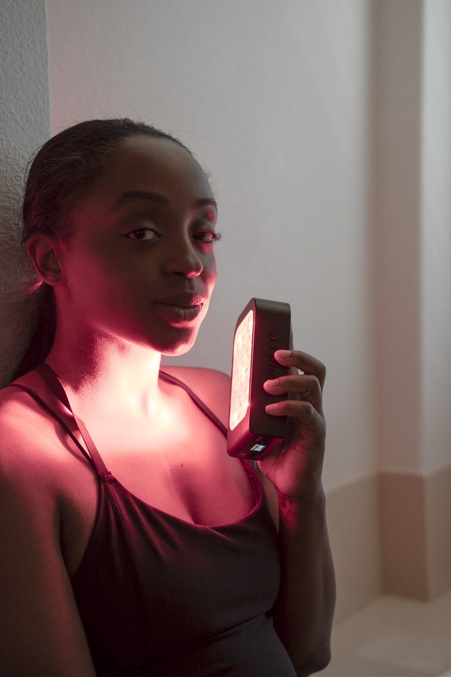 Woman using the FOCUS on her neck